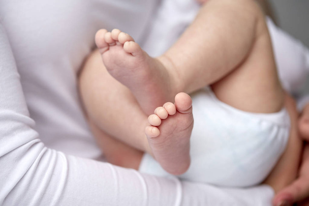 close up of newborn baby in mother hands - Valokuva, kuva