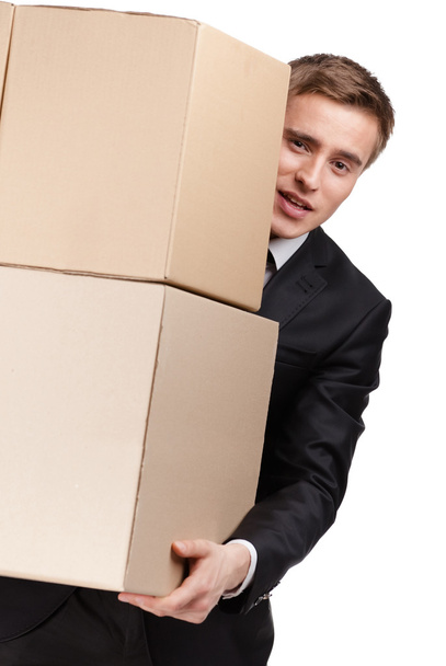 Manager holding pile of boxes - Foto, Bild