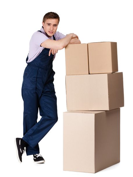 Young delivery man in overalls with containers - Photo, Image