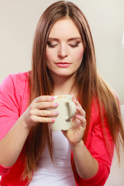 Woman drinking hot coffee beverage. Caffeine. - Fotó, kép