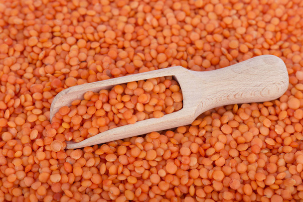 Red lentils with a wooden spoon - Photo, Image