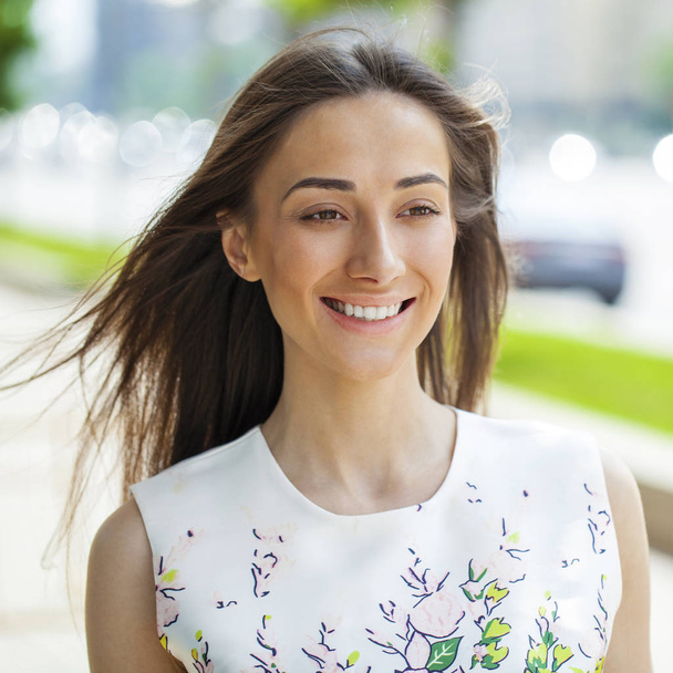 Closeup portrait of a happy young woman smiling - Photo, image