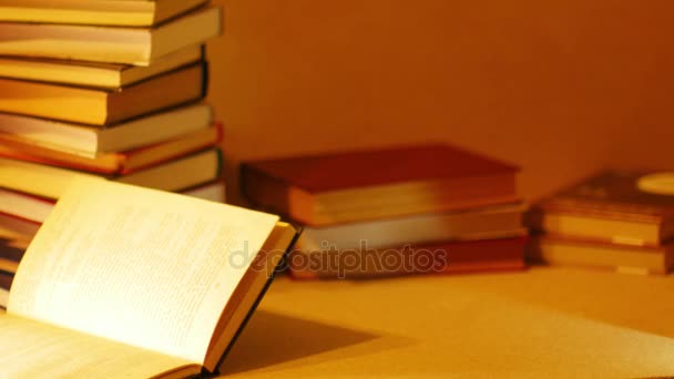 Stack of books with an inscription SUMMER BOOK. Stop motion - 映像、動画
