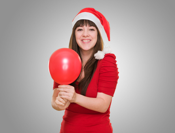 felice Natale donna in possesso di un palloncino
 - Foto, immagini