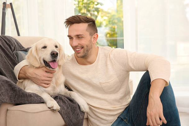 Handsome man with dog - Photo, image