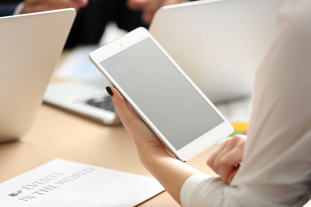Businesswoman holding tablet during meeting in office - Foto, Imagem