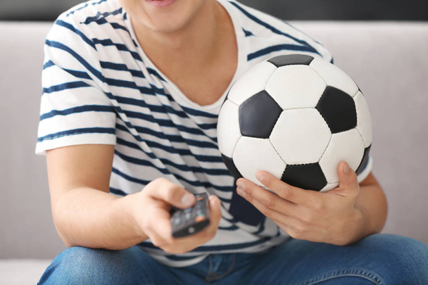 Teenager watching football - Valokuva, kuva