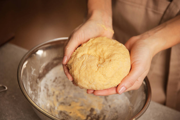 woman making dough in kitchen - 写真・画像