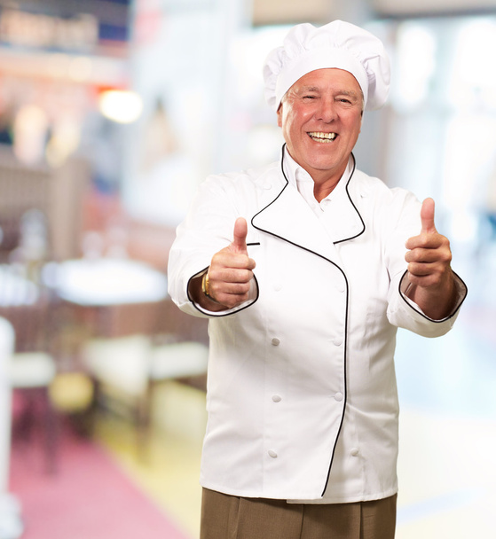 Портрет шеф кухаря з ручним знаком
 - Фото, зображення