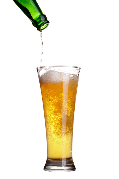 Beer pouring from green bottle into glass isolated on white - Fotó, kép