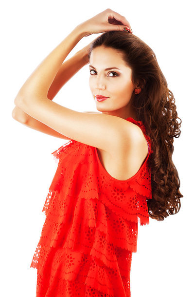 sexy woman in red dress with long curly hair - Valokuva, kuva