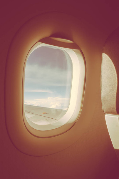 View through plane window .( Filtered image processed vintage ef - Φωτογραφία, εικόνα