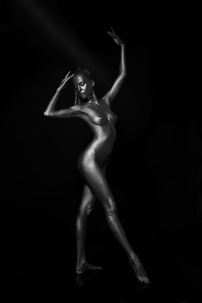naked body in a silver body painting - 写真・画像