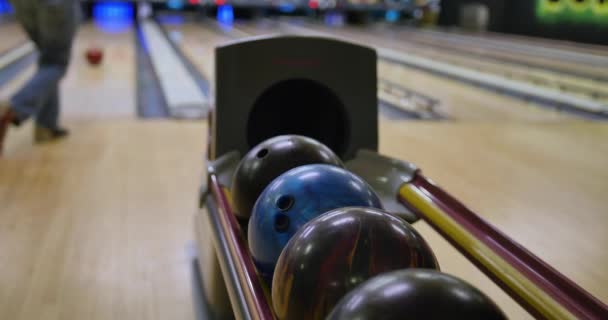 People Pickup Bowling Balls from Return at Alley - Footage, Video