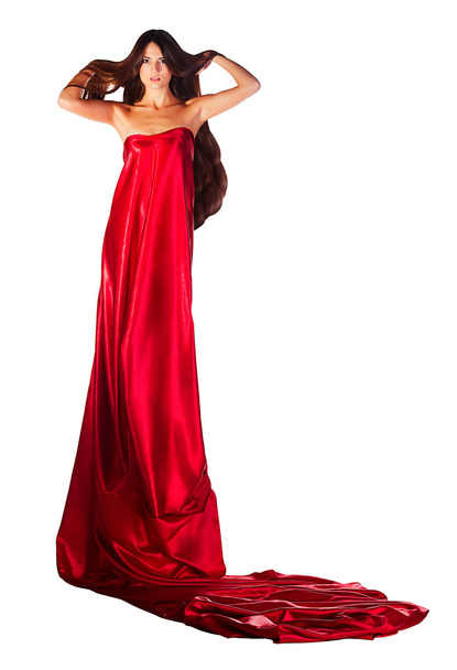 woman in red dress with hands in hair - Фото, зображення