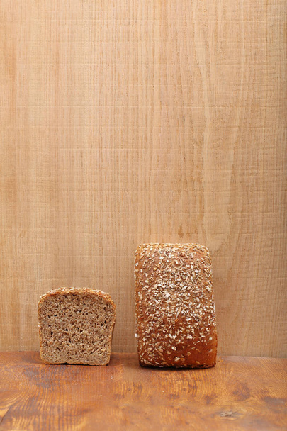 Healthy bread with seeds on wooden background and empty space fo - Фото, изображение