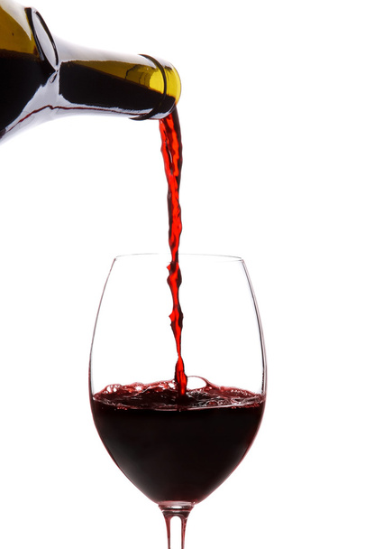 Red wine pouring down from a wine bottle isolated on white - Zdjęcie, obraz