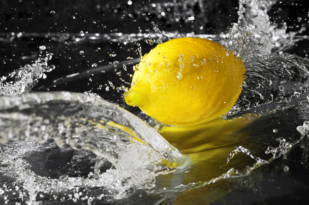 fresh water drops on lemon on black background - Foto, immagini