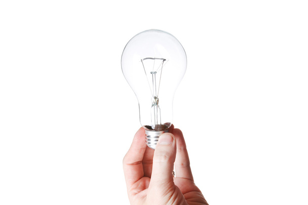 Light bulb in a hand isolated on white background - Foto, Imagem