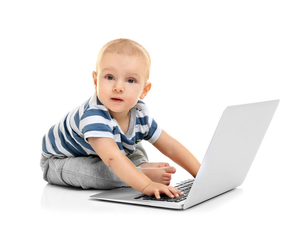Cute baby boy with laptop - 写真・画像