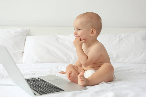 Cute baby boy with laptop - Zdjęcie, obraz