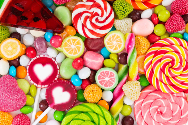 Colorful lollipops and different colored round candy.   - Photo, Image