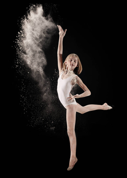 Little girl dancing with white powder - Zdjęcie, obraz
