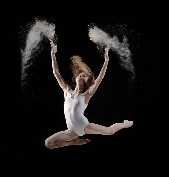 Little girl dancing with white powder - Foto, imagen