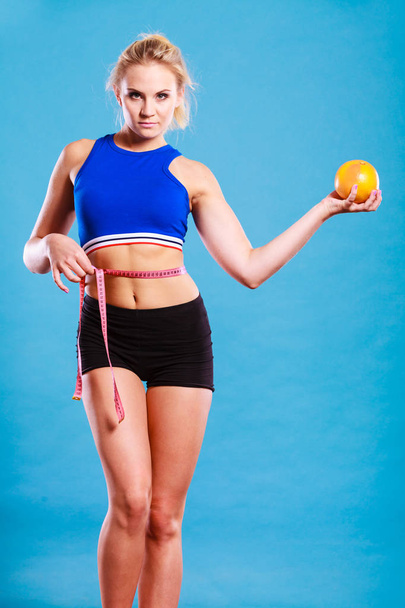 woman fit girl with measure tape and grapefruit - Zdjęcie, obraz