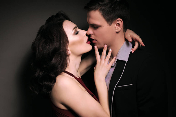 fashion studio photo of lovely impassioned couple in elegant out - Zdjęcie, obraz