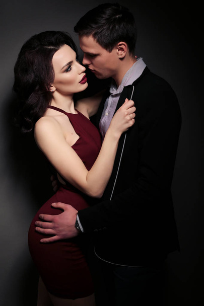 fashion studio photo of lovely impassioned couple in elegant out - Foto, Bild