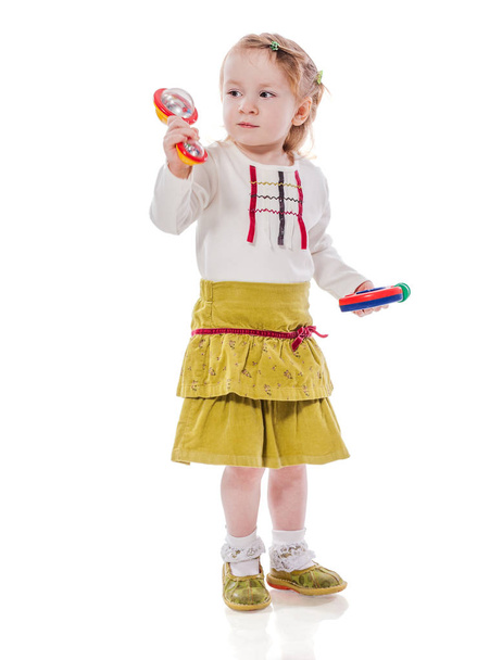 Girl playing rattle - Foto, afbeelding