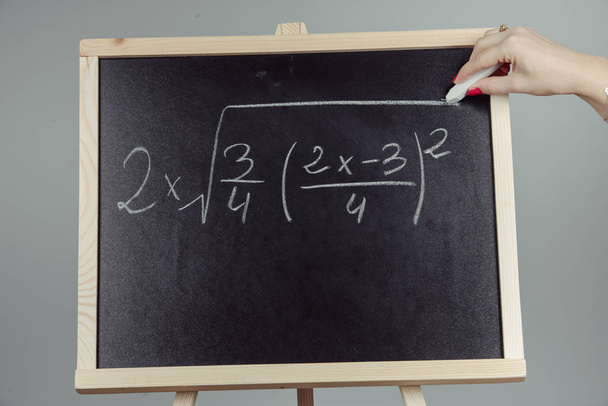 Math exercise on chalkboard - Fotó, kép