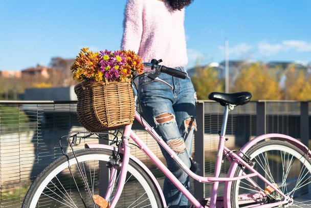 Black young woman riding a vintage bicycle - Photo, Image