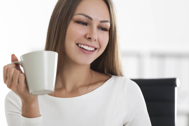Close up of positive girl with coffee smiling  - Фото, зображення