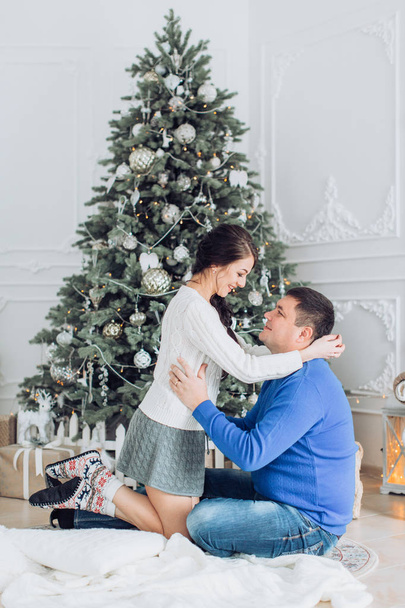 family  at home with decorated Christmas interier - Valokuva, kuva