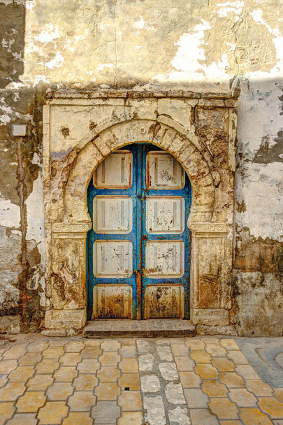 Traditional old painted door in a historical district or medina, Tunisia. - Valokuva, kuva