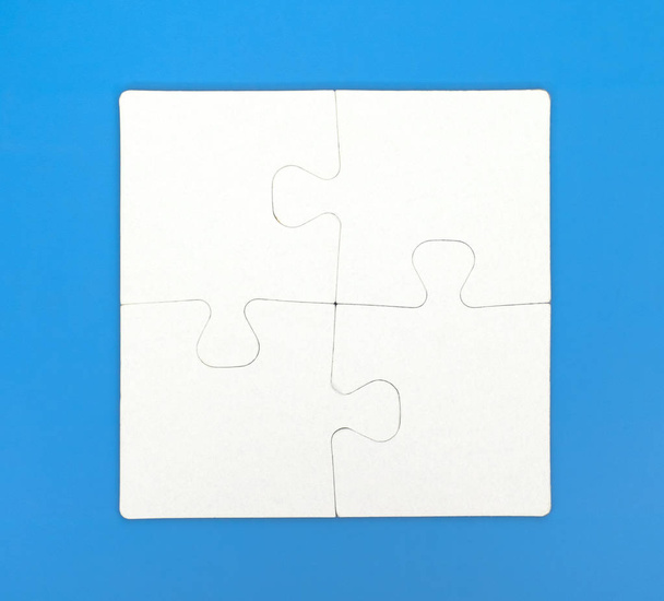 Four pieces of puzzle are connected together - Foto, immagini