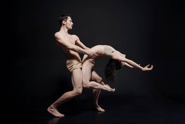 Athletic dancers taking part in the art performance - 写真・画像