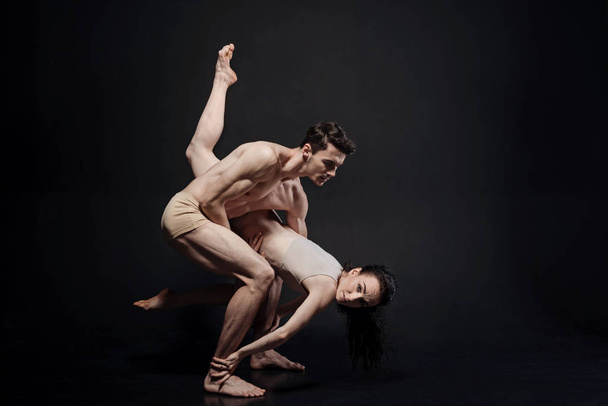 Inspired athletes demonstrating their flexibility in the studio - Foto, Imagem