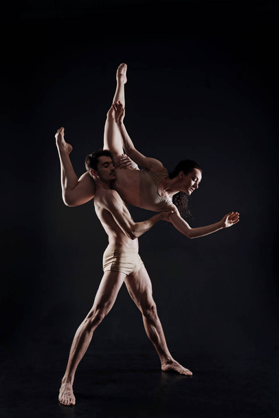 Professional young gymnasts dancing in the studio - Photo, Image