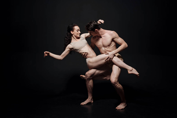Delighted ballet dancers acting in the studio - Photo, Image