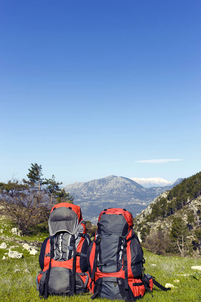 Backpack in the mountains with views of the mountains.  - Photo, Image
