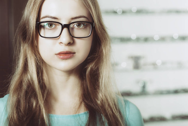 portrait of young woman wearing glasses - 写真・画像