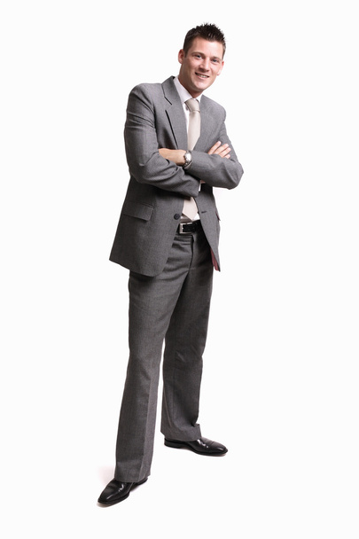Young handsome businessman standing alone - 写真・画像