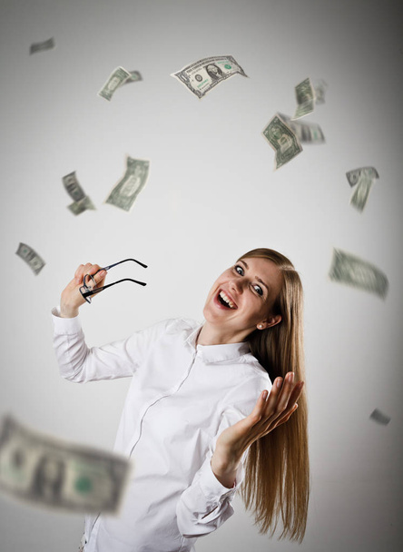 Rejoicing. Woman in white and Dollars. - Photo, Image
