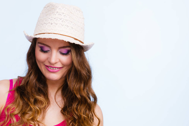 Woman in summer straw hat on head smiling - Foto, imagen