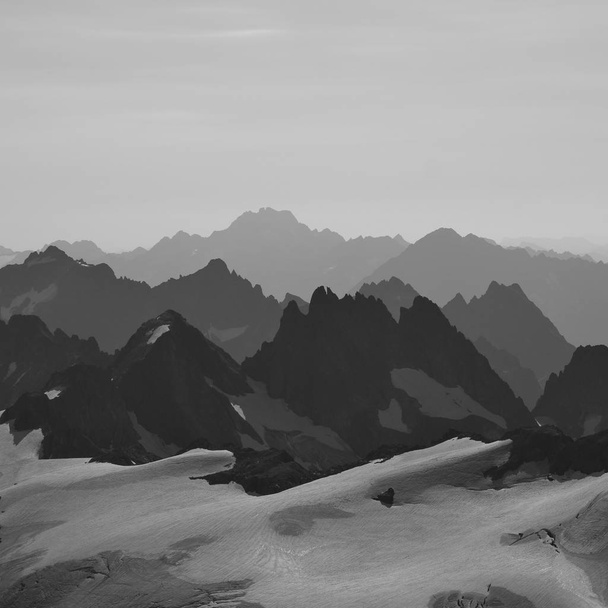 Rugged mountains and glacier, view from mount Titlis - Photo, Image