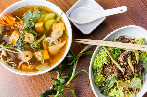 Asian dinner dishes -  soup and salad  - Foto, Imagem