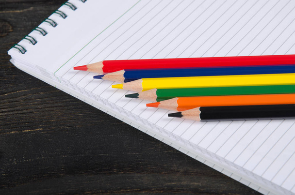 Colored pencils and a notebook - Fotó, kép